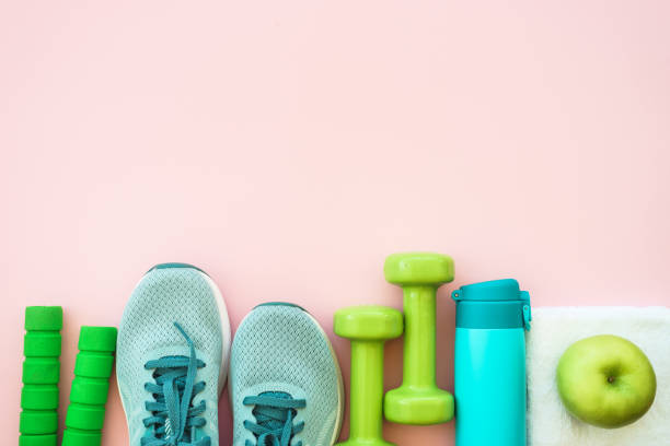 istock Fitness equipment on pink background, flat lay image. 1637913203