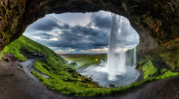 istock Natural cave with Seljalandsfoss waterfall flowing in summer at Iceland 1637920326