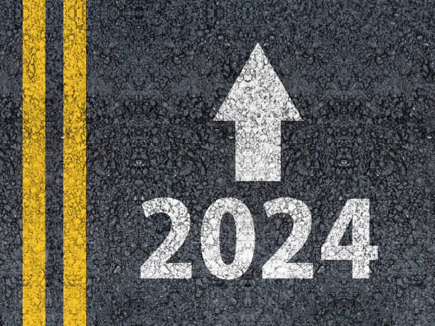 Year 2024 and an arrow written on an asphalt road