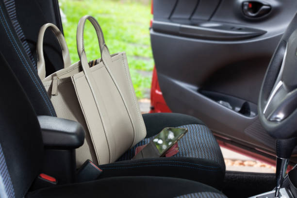 leather bag and phone on the car seat.