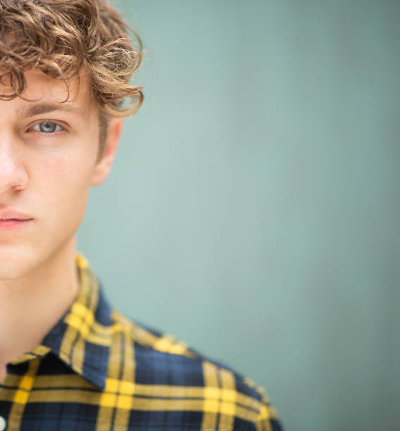 istock Half face portrait of young man 1637960629