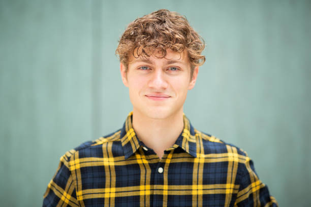 Portrait of handsome young guy in checked shirt
