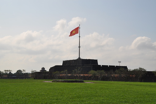 Big flag post with a Vietnamese flag near the former DMZ in Vietnam.