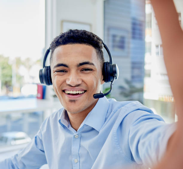 istock Happy man, call center selfie and communication portrait in customer service or technical support on social media. Face of consultant, virtual agent or business person smile in office profile picture 1637981993