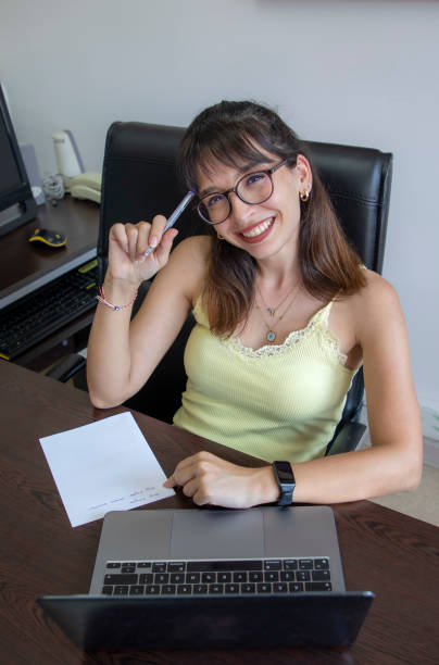 A woman working with a computer in her office