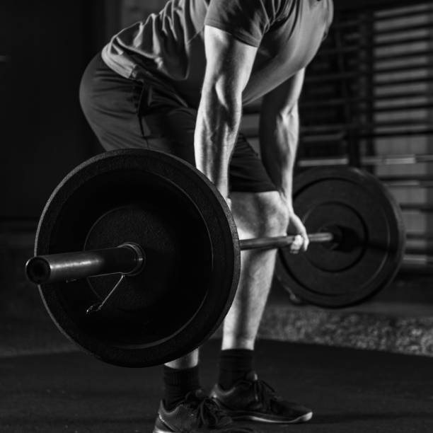 istock Intense Cross Training Male Athlete Conquering Barbell Challenge 1638009281
