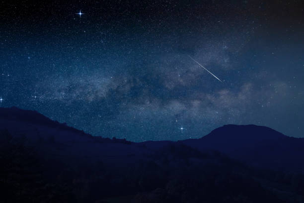 istock Shooting star, Milky way and landscape silhouettes. 1638011996