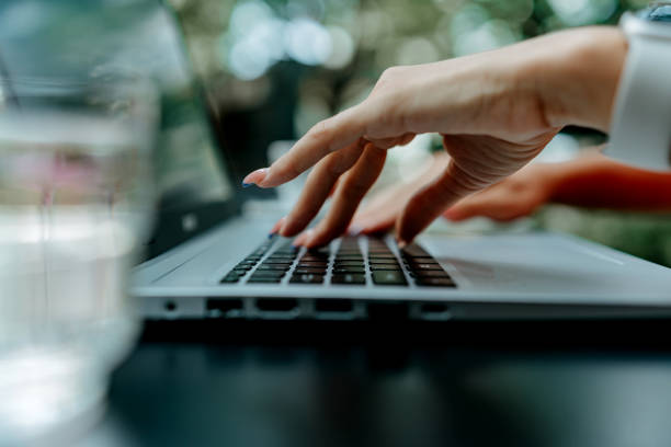 istock Close up woman typing on laptop 1638017844