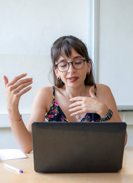 istock A teacher teaching with her computer in a classroom at a school 1638049277