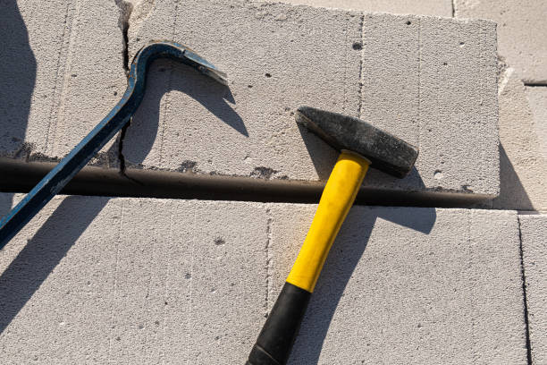 istock Scrap and hammer on a concrete block 1638054791