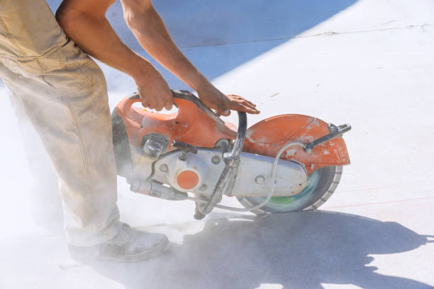 istock Construction worker with working diamond blade saw to cut off concrete paving a sidewalk 1638064234