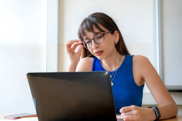 istock A teacher teaching with her computer in a classroom at a school 1638065354