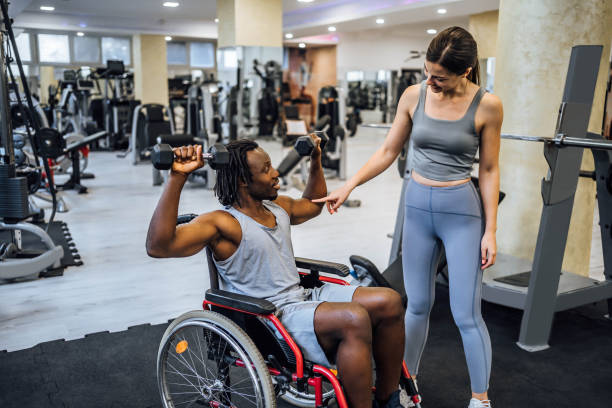 istock Disabled young man having exercise class with a fitness instructor 1638067668