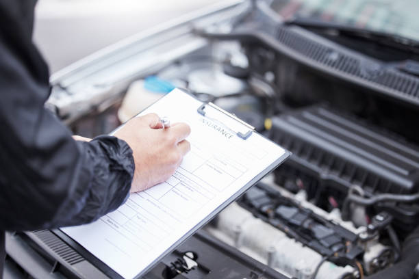 istock Checklist, car insurance and man writing on documents for compliance, maintenance and engine control. Vehicle, inspection and hand of male mechanic with paper form for information, note and claim 1638069824