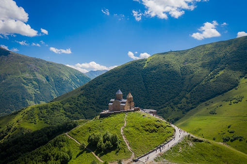 Gergeti Trinity Church against Caucasus mountains in Georgia