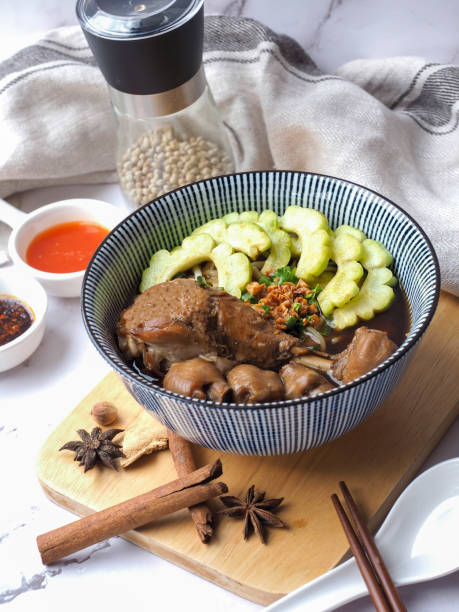 Noodle with braised chicken and  bitter melon in brown soup - Thai style of boat noodles called Kuay Teow Kai Toon