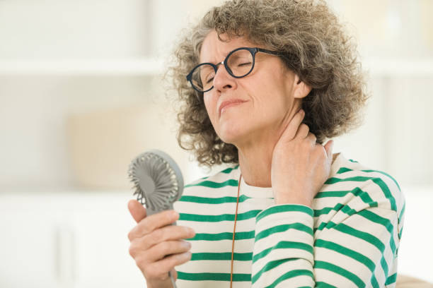 istock Menopausal woman having a hot flash 1638087699