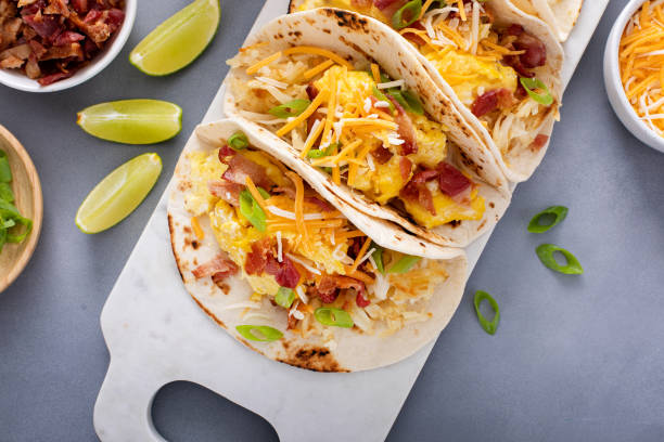 istock Breakfast tacos with hash browns, eggs and bacon 1638098396