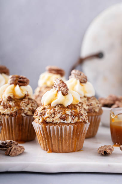 istock Caramel pecan cupcakes with cream cheese frosting 1638098627