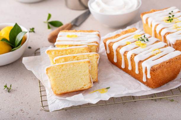 istock Classic lemon pound cake with powdered sugar glaze dripping over 1638099207