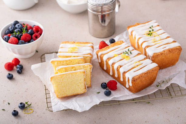 istock Classic vanilla pound cake with powdered sugar glaze sliced on parchment 1638099231