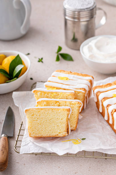 istock Classic lemon pound cake with powdered sugar glaze dripping over 1638099239