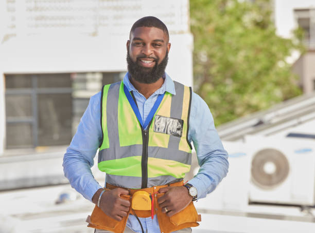 istock Black man, portrait and construction, maintenance and engineer with smile and architecture outdoor. African male contractor, professional renovation and urban infrastructure, handyman with tools 1638102332