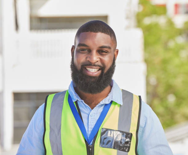 istock Black man, portrait and construction worker, maintenance and engineering with smile and architecture outdoor. African male person, renovation and contractor with urban infrastructure and handyman 1638102557