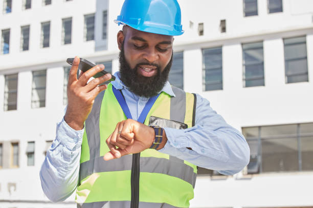 istock Black man, time or architect on a phone call or construction site speaking of building schedule or project. Voice speaker, talking or African designer in communication or discussion about engineering 1638102599
