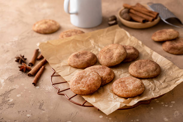 istock Cinnamon cookies on a parchment paper with milk 1638116082