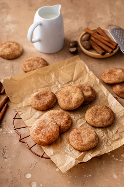 istock Cinnamon cookies on a parchment paper with milk 1638116083