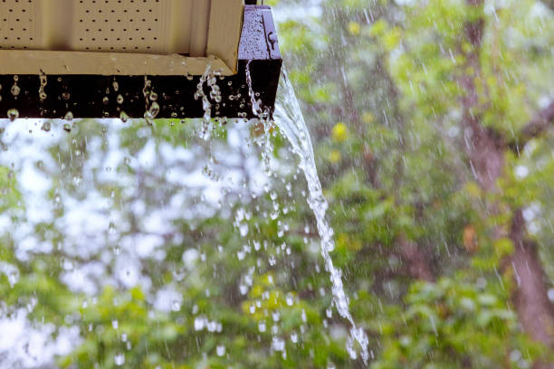 istock During heavy rain, water cascades from the overflowing gutters. 1638123775
