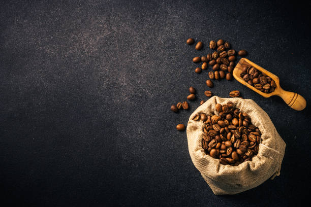 roasted coffee beans in burlap bag. - sack bag bean burlap imagens e fotografias de stock