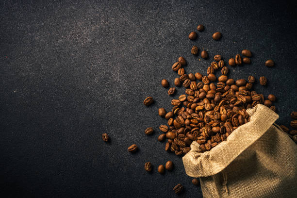 roasted coffee beans in burlap bag. - sack bag bean burlap imagens e fotografias de stock