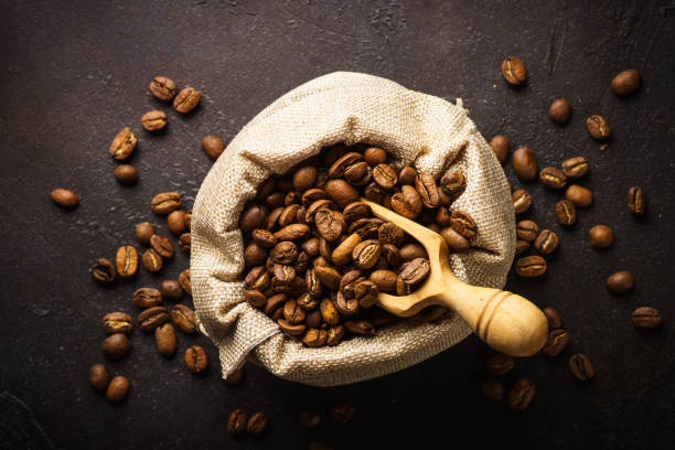 roasted coffee beans in burlap bag. - sack bag bean burlap imagens e fotografias de stock