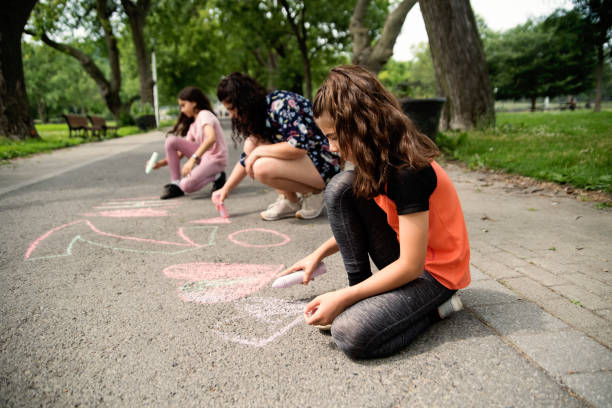 istock Mother of middle-eastern ethnicity playing with two active daughters in park. 1638161232