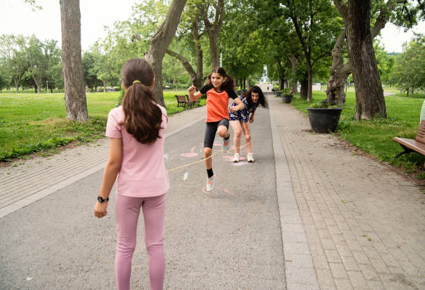 istock Mother of middle-eastern ethnicity playing with two active daughters in park. 1638162864