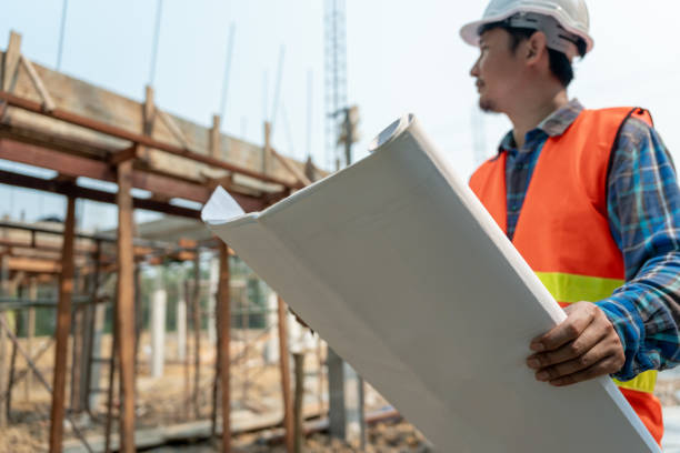 istock inspector or engineer is inspecting construction and quality assurance new house using a blue print. Engineer or architects or contactor work to build the house before handing it over to the homeowner 1638273144