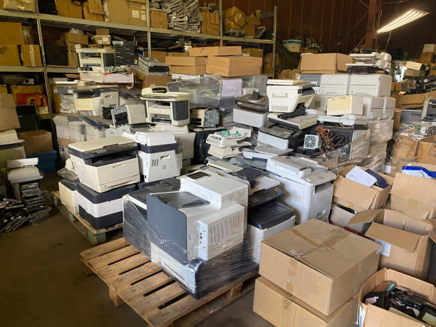 istock Sorting electronic waste for recycling. Cell phone photo of a warehouse. 1638291360