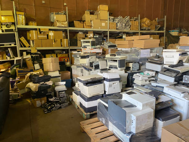 istock Sorting electronic waste for recycling. Cell phone photo of a warehouse. 1638291362