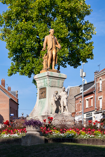 Montdidier, France - September 12 2020: Bronze statue representing the agronomist and nutritionist Antoine Augustin Parmentier, made by Roze and inaugurated in 1931.