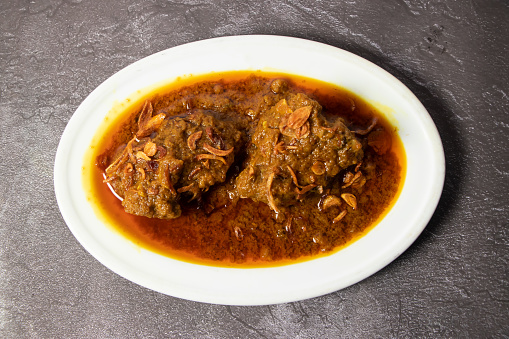 Mutton Bhuna, vindaloo, rogan josh, karahi, korma masala gravy served in dish isolated on background top view of bangladesh food