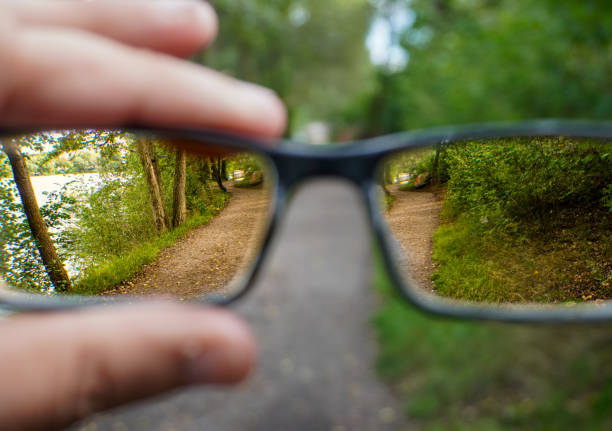 istock Cropped hand holding glasses outdoors 1638343348