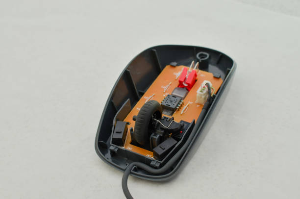 istock Open computer mouse with exposed electronic circuit for maintenance, symbol of technology and modern computing. Perfect for technology concepts, digital age symbol and technology solutions. 1638392658