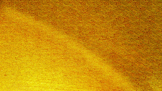 Background with gold foil texture Yellow has a copper and black reflection gold foil background