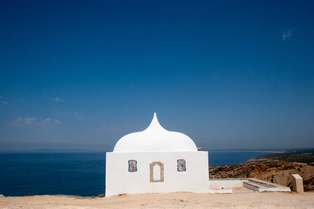 istock Chapel on a cliff by the sea 1638411995
