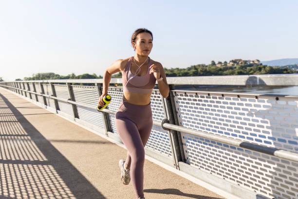 istock Cheerful Asian female runner 1638425835