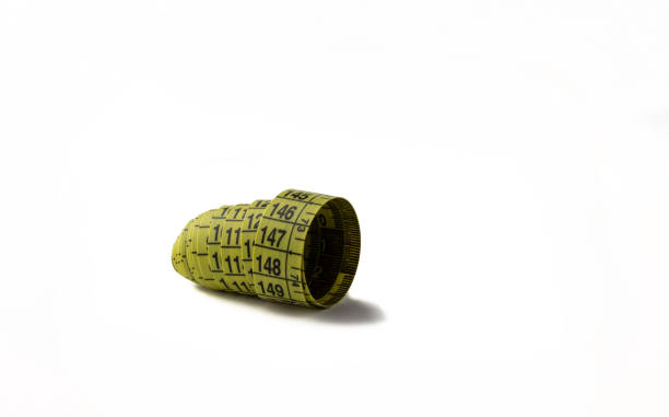 istock Measuring tape for a tailor rolled up on a white background. 1638432394