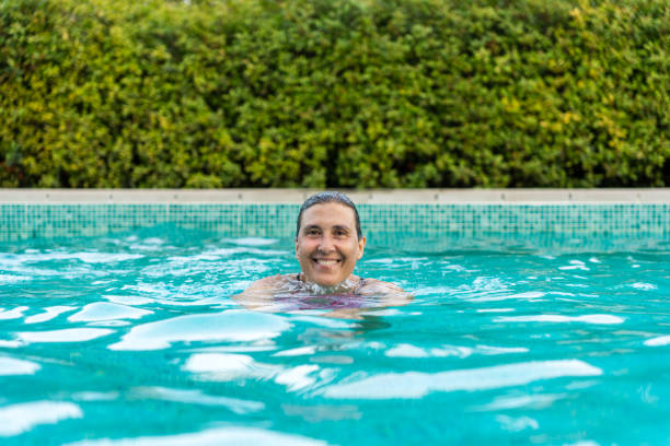 istock A woman swimming in a pool. 1638437495