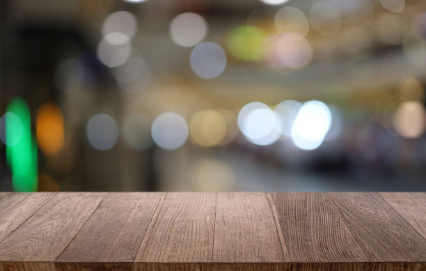 istock Wood table top in front of abstract blurred background. Empty wooden table space for text marketing promotion. blank wood table surface copy space 1638451374